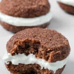 Close up shot of a Keto Gingerbread Whoopie Pie with a bite taken out of it.