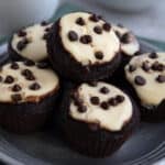 Keto Chocolate Cheesecake Muffins piled up on a pewter plate.