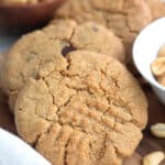 Close up shot of Keto Air Fryer Peanut Butter Cookies on a wooden cutting board.