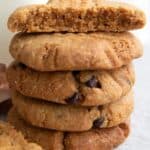 Titled image of a stack of Keto Air Fryer Peanut Butter Cookies with one broken open on top.
