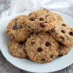 Keto Oatmeal Cookies on a white plate on a gray wooden table.