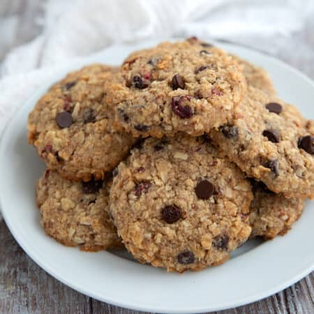 Keto Oatmeal Cookies on a white plate on a gray wooden table.