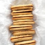 Top down image of Keto Milano Cookies on their side in a dish lined with white parchment paper.