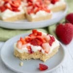 A Keto Strawberry Shortcake Bar with a bite taken out of it on a small gray plate.