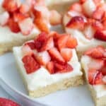 Close up shot of Keto Strawberry Shortcake Bars on a white plate.