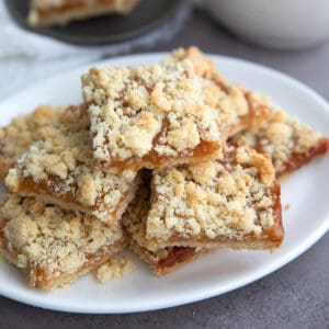 Keto Salted Caramel Butter Bars piled up on a white oval dish.